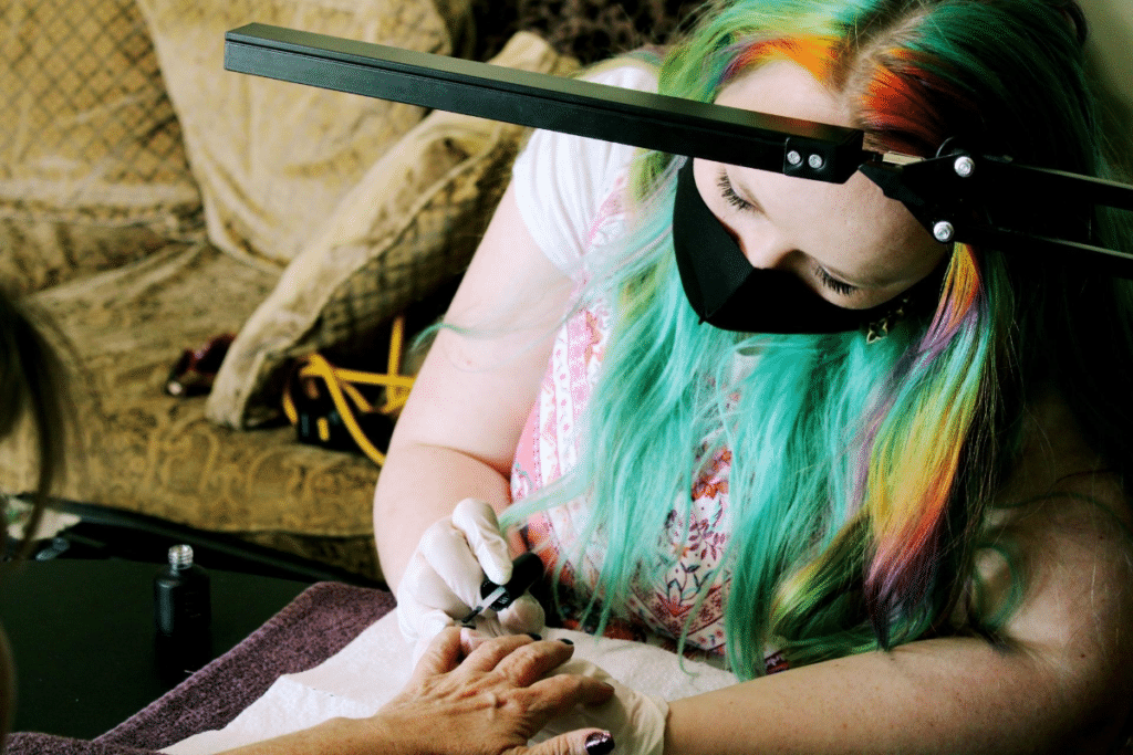 Sanna Styles Mobile and Traveling Nail Salon working on nails in a living room